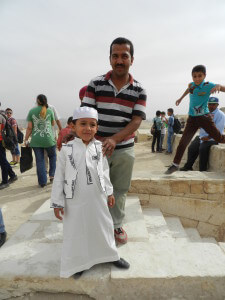 egyptian boy in robe at pyramids